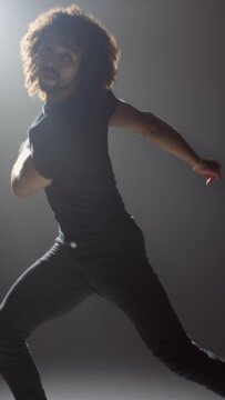 Vertical Shot of a Dancer Breakdancing