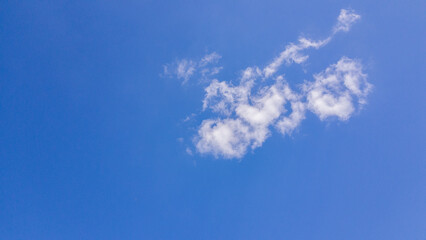 Fototapeta na wymiar white clouds floating in the blue sky
