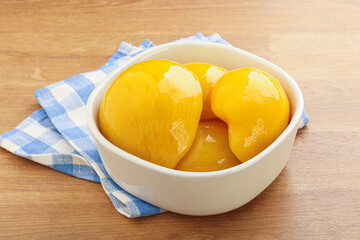 Sweet canned peaches with syrope