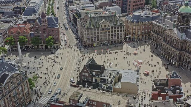 Amsterdam Netherlands Aerial v15 cinematic birds eye view capturing historical cityscape above dam square dominated by royal palace suited at centrum borough neighborhood - August 2021
