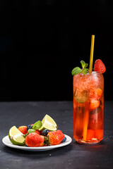 lemonade strawberry mojito cocktail, on a black isolated background