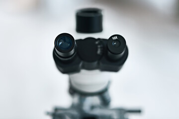 Place your eyes as close as you can. Still life shot of the eyepiece on a microscope in a laboratory.