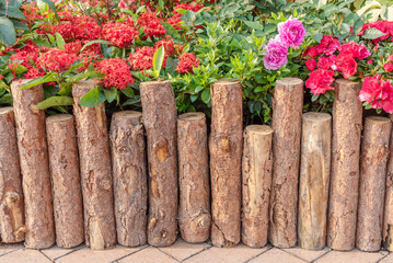 Wooden fence in beautiful backyard flower garden