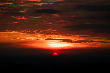 nature sunset landscape scene view, panorama natural view for using in background or concept of environmental and sustainable development, The sun downing over the cloud sky and local mountain land