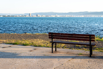 An empty bench overlooking the sea. Bulgaria's landscape. Beautiful sunny weather. 