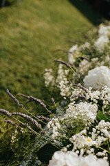 Wedding. Banquet. Chairs and honeymooners table decorated with candles. Beautiful decoration, beautiful flowers.