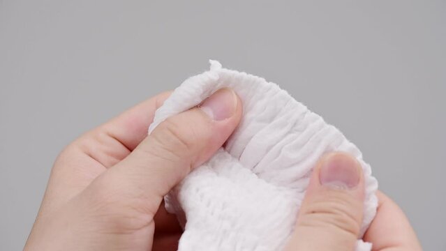 Pile of baby diaper panties diaper isolated on background, close-up, copy space, infant