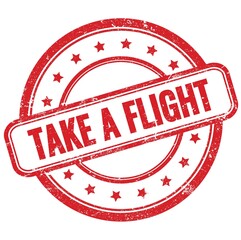 TAKE A FLIGHT text on red grungy round rubber stamp.