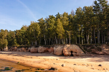 Baltic Sea coast with sandy beach and red sandstone cliffs, Veczemju cliffs, Latvia