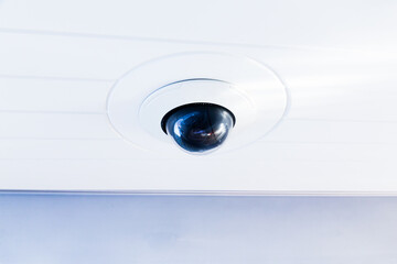 CCTV camera on the hull of an expensive motor yacht. CCTV camera white on a white body.