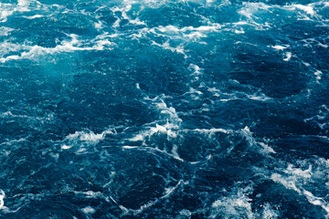 Stormy blue Aare river in Switzerland, close-up.