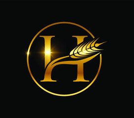 A vector illustration of Golden Wheat Grain Monogram Initial Letter H