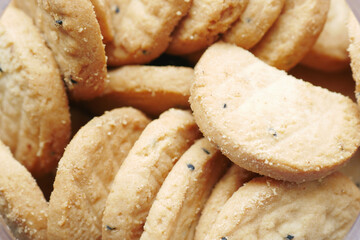 close up of sweet cookies on wooden table 