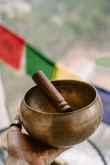 Ancient Tibetan singing bowl handmade in Nepal. Traditional sound healing ceremony. 