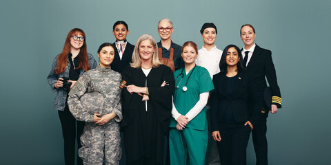 Multicultural female workers smiling in a studio