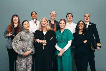 Successful female workers smiling happily in a studio