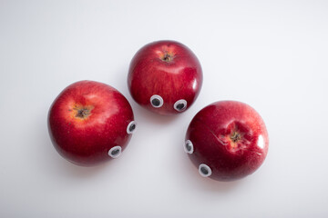 Funny red apples with eyes