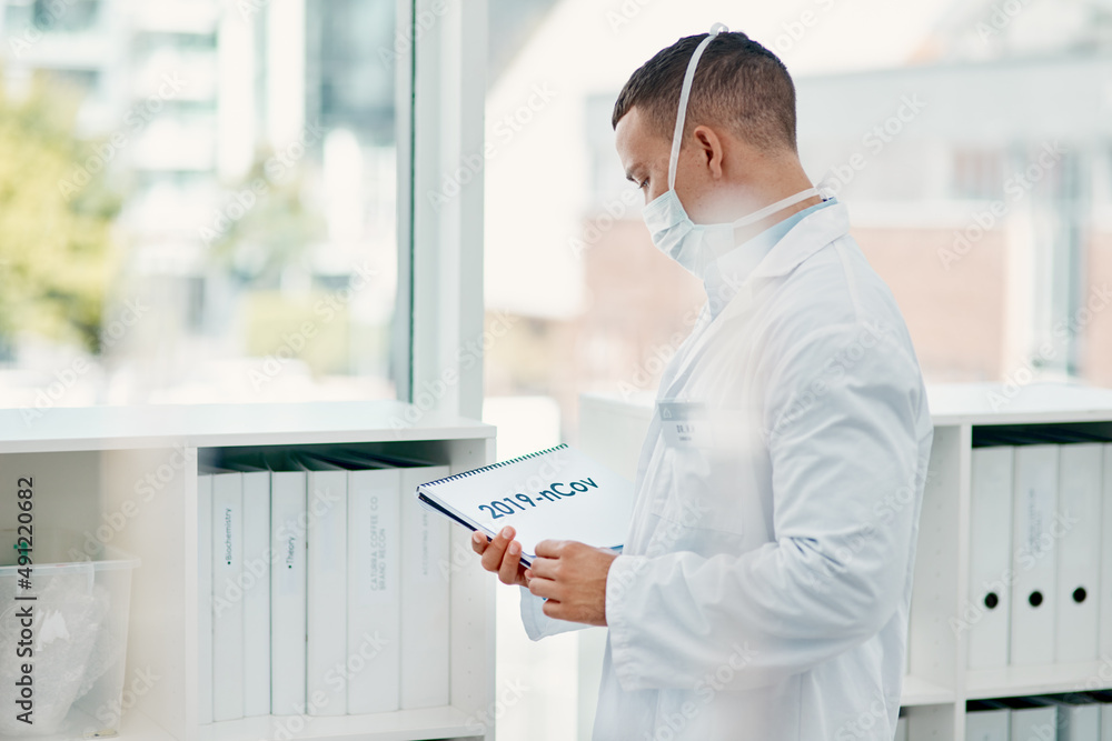 Aufkleber covid-19 is keeping scientists on their toes. shot of a young scientist holding a notepad with 2019-
