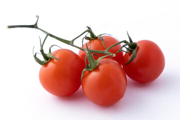 Organic cherry tomatoes on white