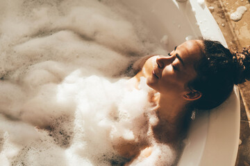 Beautiful woman relaxing at spa. Young lady relaxing in jacuzzi.