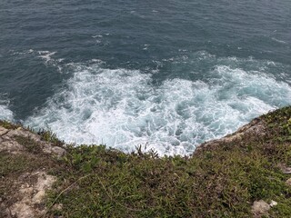 waves crashing on rocks