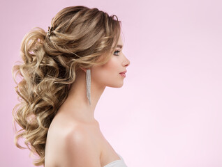 Bride Hairstyle and Make up. Woman Bridal Pinned Hair Curls. Model with Low Ponytail Evening Hairdo...