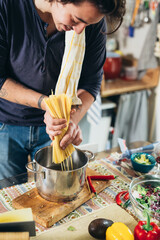 man preparing food in kitchen
