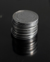 Coin stacks on a black background