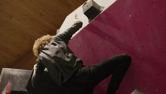 slow motion rock climbing transition from low hold to high hold dynamo 