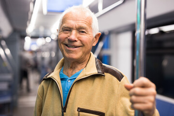 Portrait of man traveling in subway train during daily