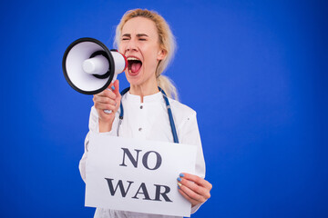A female doctor shouts into a megaphone and holds a poster saying no war