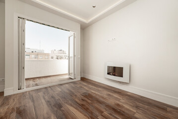 Fototapeta na wymiar empty living room with a coal stove and terrace with a large folding window