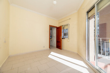 Aluminum window with access to a viewing terrace, mahogany-colored wooden window and door with white stoneware floors