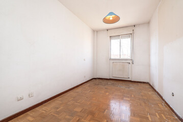 living room with aluminum window, hot water radiator and oak parquet flooring