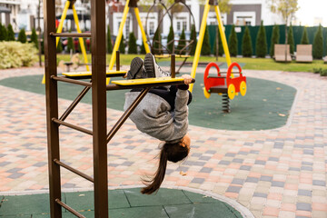 portrait of a little schoolgirl girl at the playground