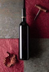 Bottle of red wine on vintage background.