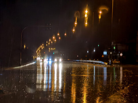 road rain night lights car abulance traffic