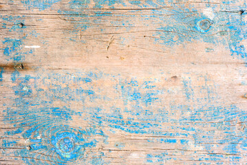 Wooden texture with scratches and cracks. It can be used as a background