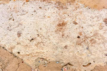 Texture of a concrete wall with cracks and scratches which can be used as a background
