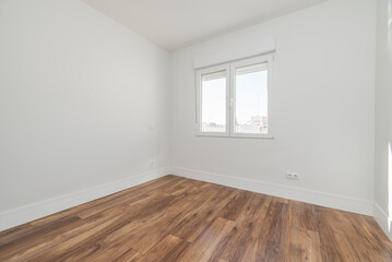 Fototapeta na wymiar empty room freshly painted with dark wood flooring and white aluminum tilt window