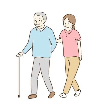 高齢男性の歩行介助をする女性ヘルパー
