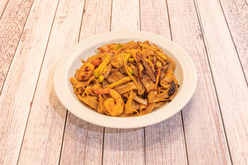 The original dish is made with rice noodles, fish sauce, shrimp, peanuts, and spices. This pasta is very rich and very original.