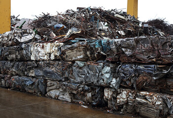 Junk yard with heap of metal waste