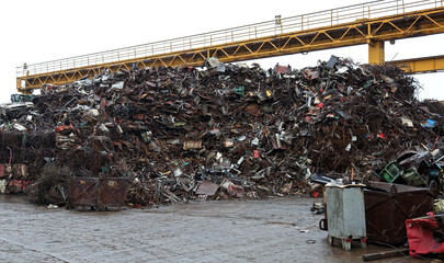 Junk yard with heap of metal waste