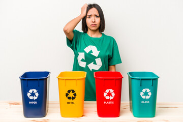 Young hispanic woman recycling isolated on white background being shocked, she has remembered...
