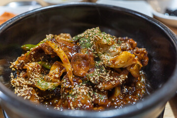 Stir-fried spicy pork with red pepper paste. It's a Korean dish. It's called Jeyukbokkeum