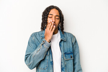 Young African American man isolated on white background yawning showing a tired gesture covering mouth with hand.