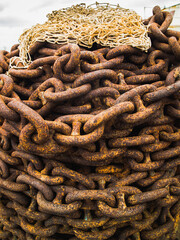 Close-up rusty iron chain with net.