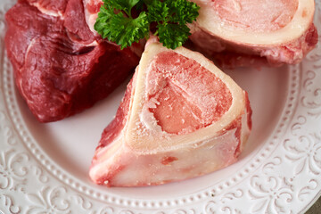 Ingredients for preparing beef bone broth or soup - fresh marrow bones