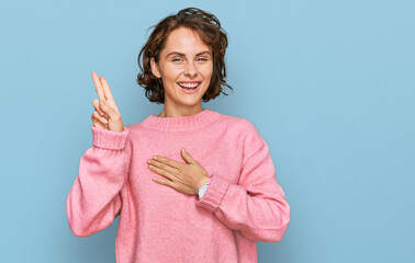 Young hispanic woman wearing casual clothes smiling swearing with hand on chest and fingers up,...